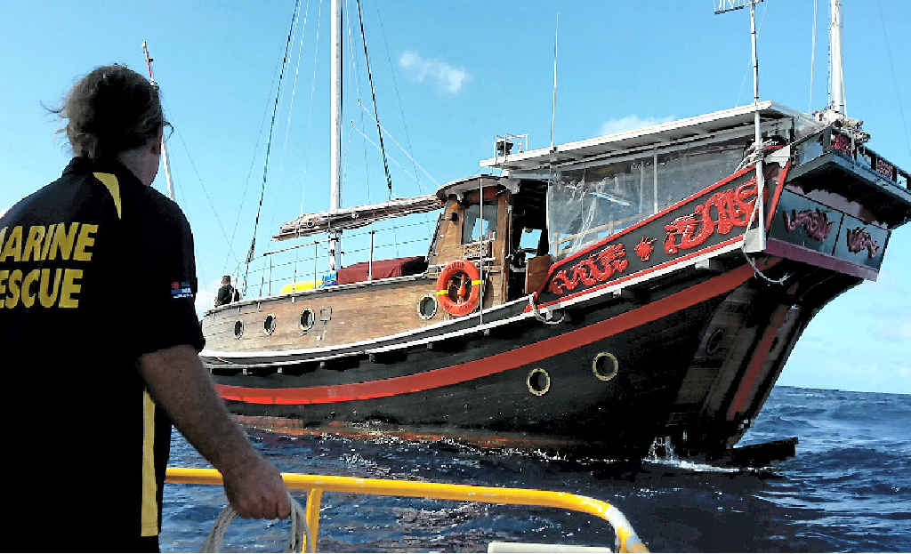 A crew member from VMR Bundaberg sights the 25-tonne Chinese junk rigged sailing vessel. A crew member from VMR Bundaberg sights the 25-tonne Chinese junk rigged sailing vessel.